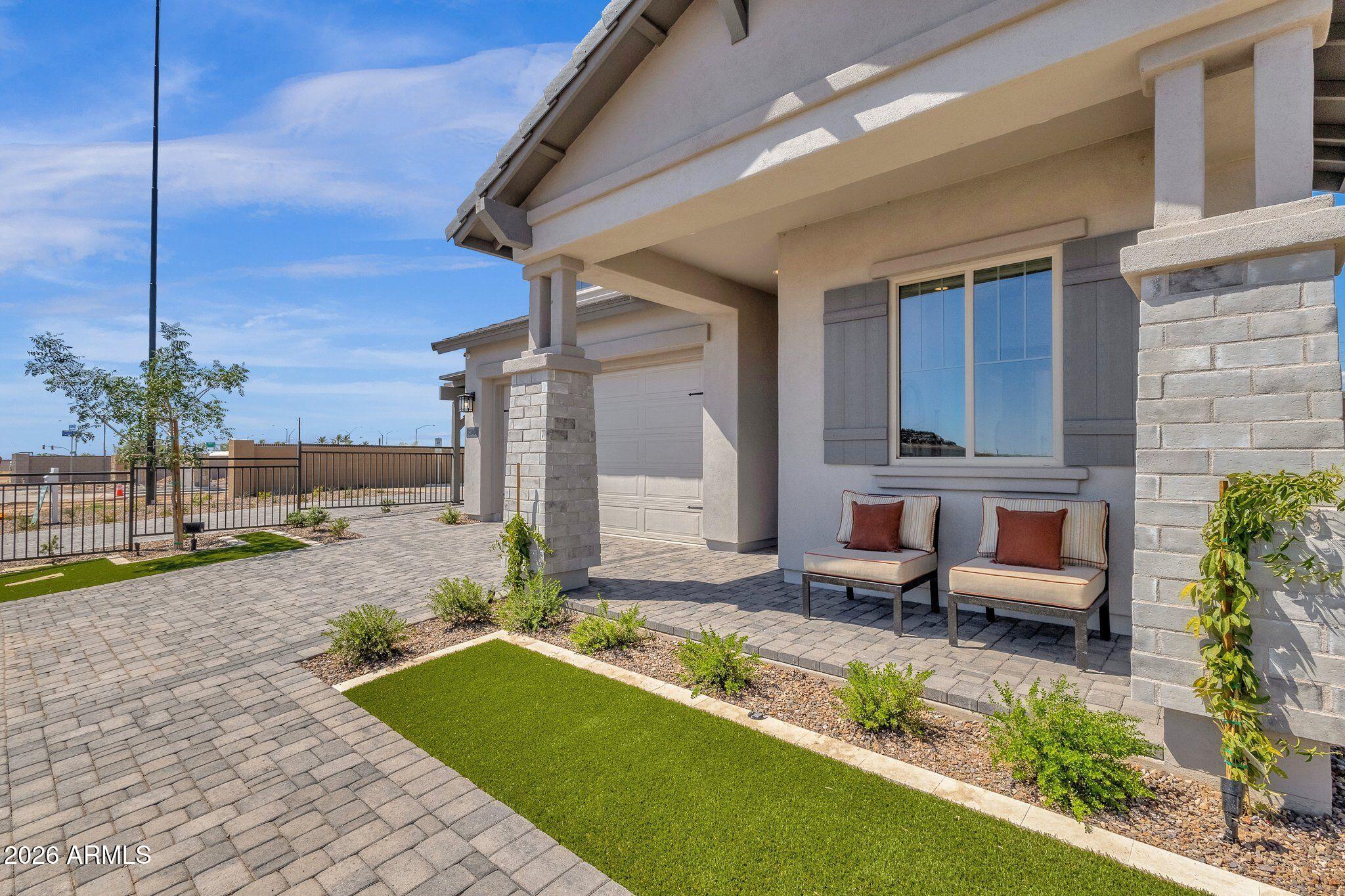3706 East Rochelle Circle Mesa, AZ 85213 - Photo 2 of 9 a front view of a house with garden