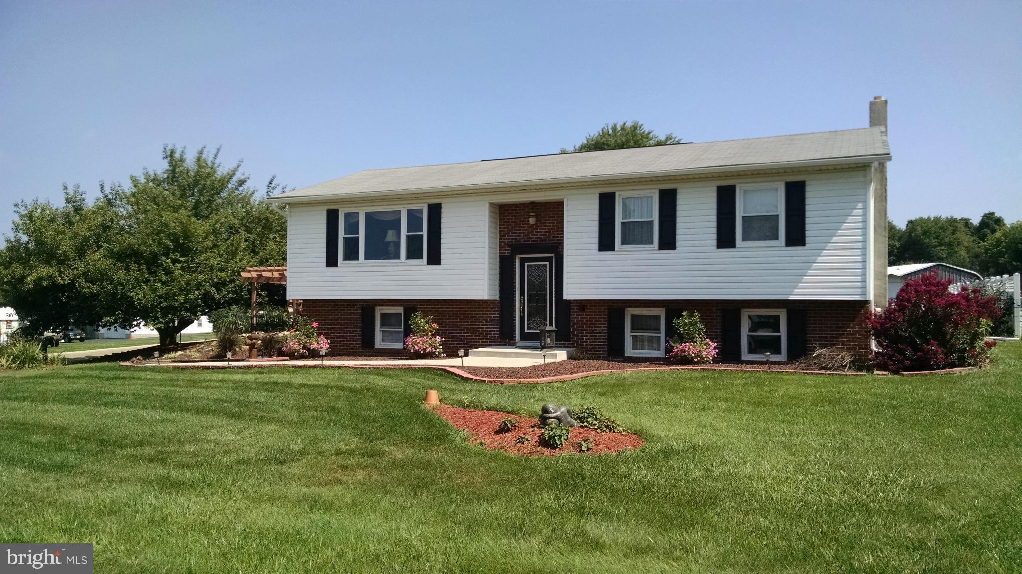 a view of a house with a yard porch and sitting area