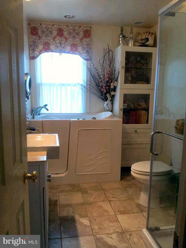 10 Tulip Drive Conowingo, MD 21918 - Photo 22 of 29 a bathroom with a toilet a sink and window