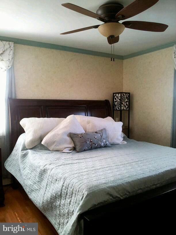 10 Tulip Drive Conowingo, MD 21918 - Photo 25 of 29 a bedroom with a bed and a chandelier
