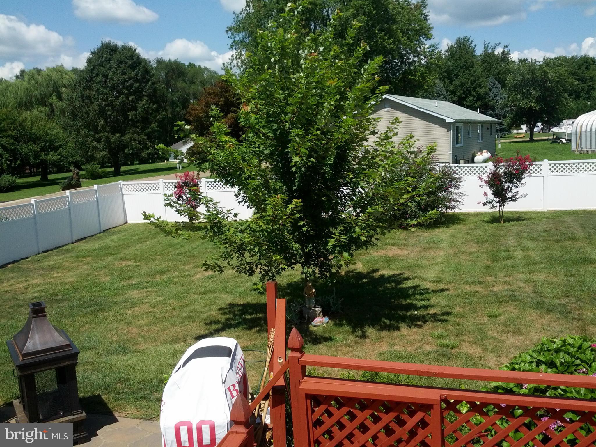 10 Tulip Drive Conowingo, MD 21918 - Photo 10 of 29 a view of a wooden deck and a backyard