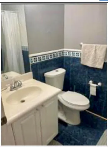 a bathroom with a sink and a toilet