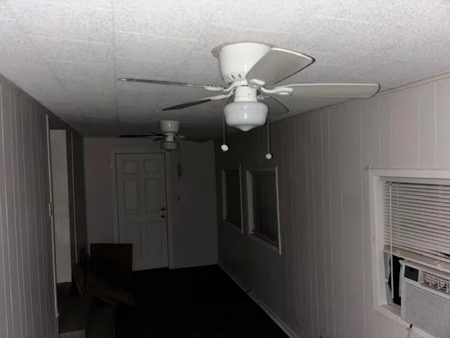 a view of a hallway with a chair