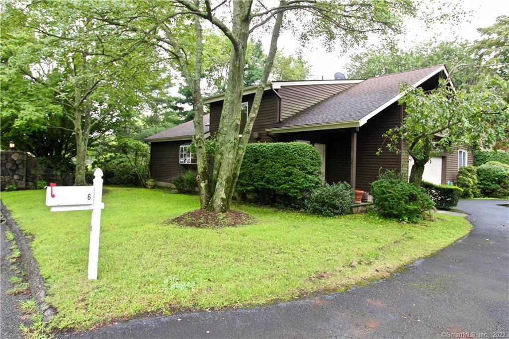 a view of a house with backyard and garden