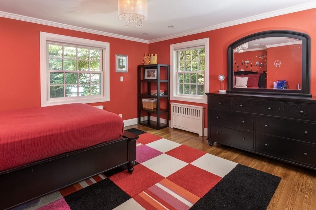 25 Plowgate Road Brookline, MA 02467 - Photo 13 of 19 a bedroom with a bed and wooden floor