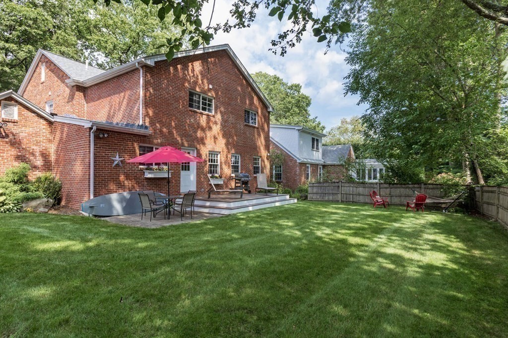 25 Plowgate Road Brookline, MA 02467 - Photo 18 of 19 a view of a house with backyard and a sitting area
