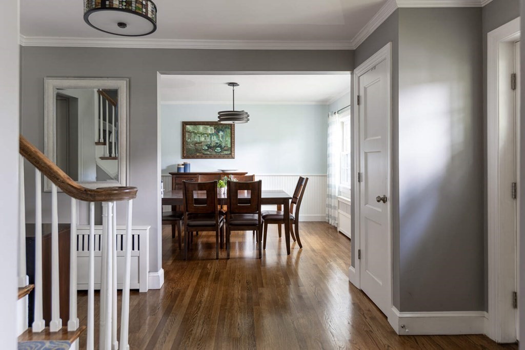 25 Plowgate Road Brookline, MA 02467 - Photo 2 of 19 a view of a dining room with furniture and wooden floor