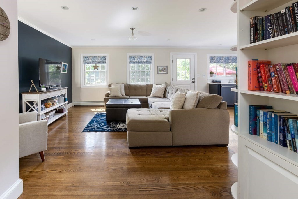 25 Plowgate Road Brookline, MA 02467 - Photo 6 of 19 a living room with furniture and a flat screen tv