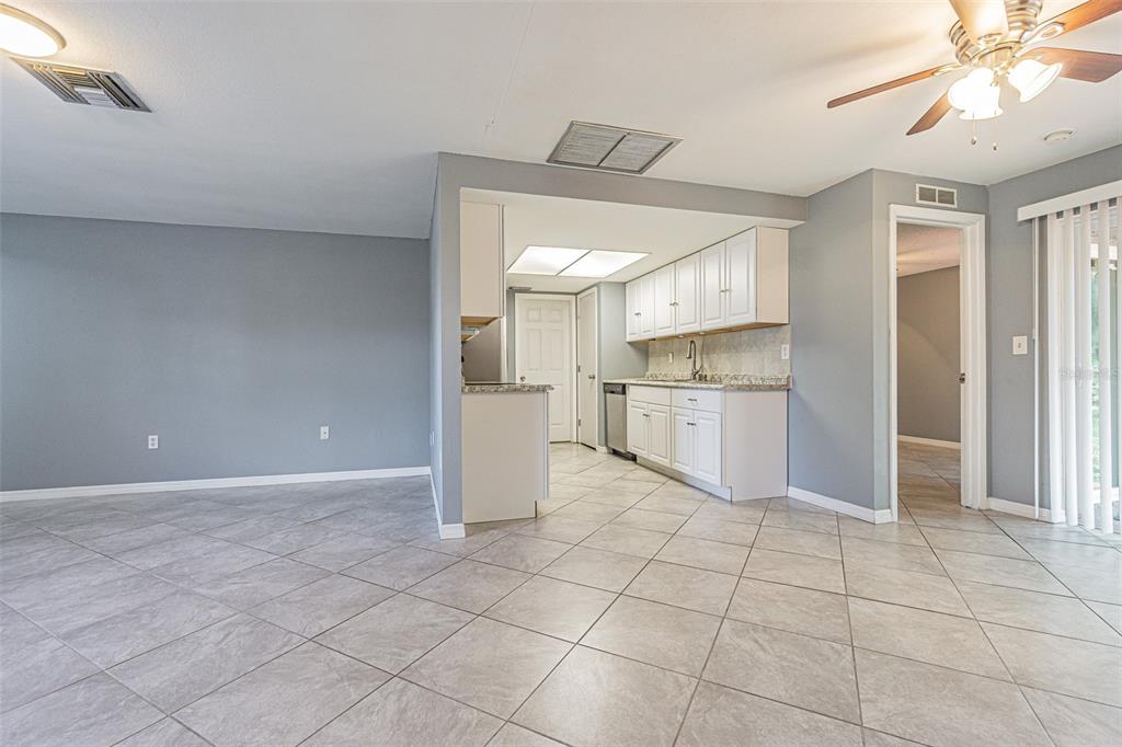 1529 Larkin Road Spring Hill, FL 34608 - Photo 12 of 37 a view of a kitchen with an empty space and a window