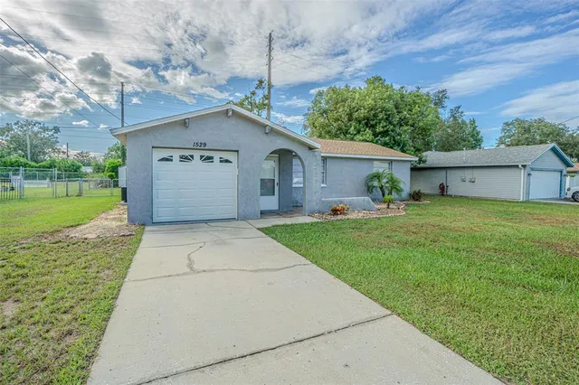 a house view with a garden space