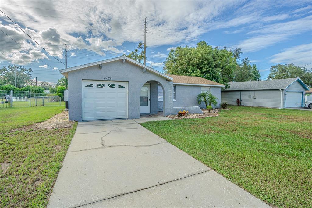 1529 Larkin Road Spring Hill, FL 34608 - Photo 16 of 37 a house view with a garden space