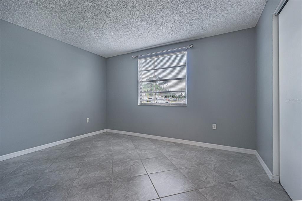 1529 Larkin Road Spring Hill, FL 34608 - Photo 22 of 37 an empty room with windows and closet