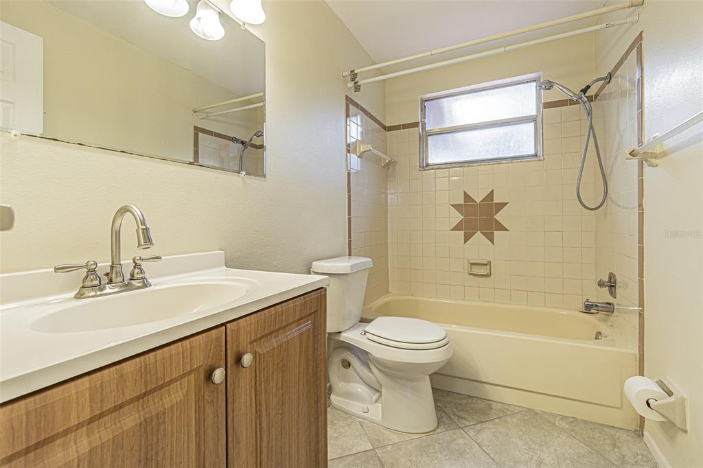 1529 Larkin Road Spring Hill, FL 34608 - Photo 23 of 37 a bathroom with a sink a toilet and shower