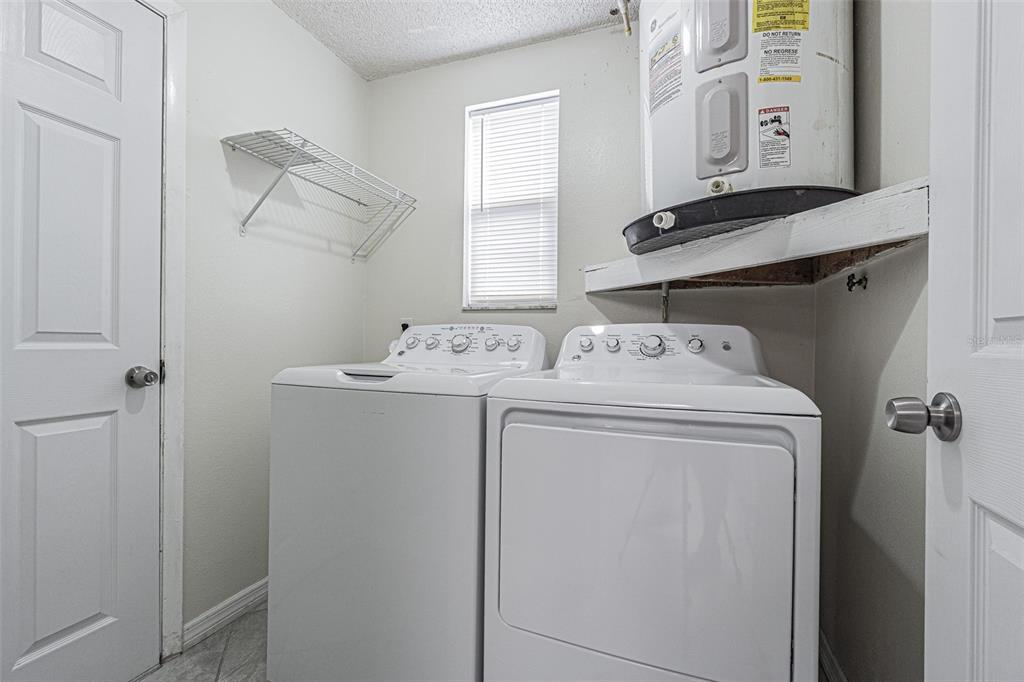 1529 Larkin Road Spring Hill, FL 34608 - Photo 26 of 37 a utility room with dryer and washer