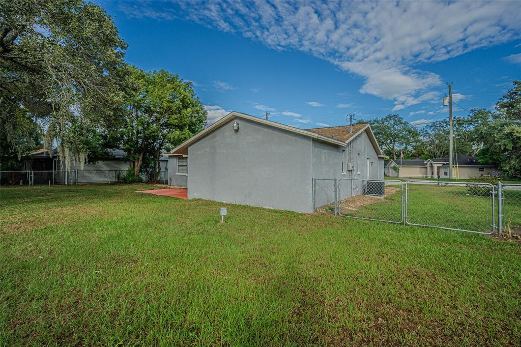 1529 Larkin Road Spring Hill, FL 34608 - Photo 30 of 37 a view of a backyard with a garden