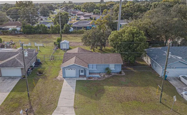 a aerial view of a house with a lake view