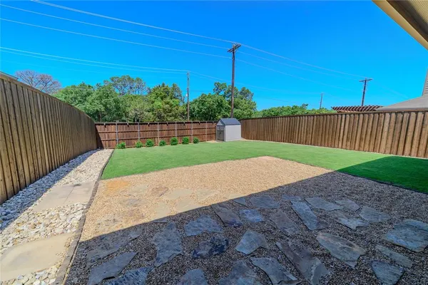 a view of a backyard with a garden