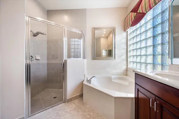a bathroom with a shower and a sink