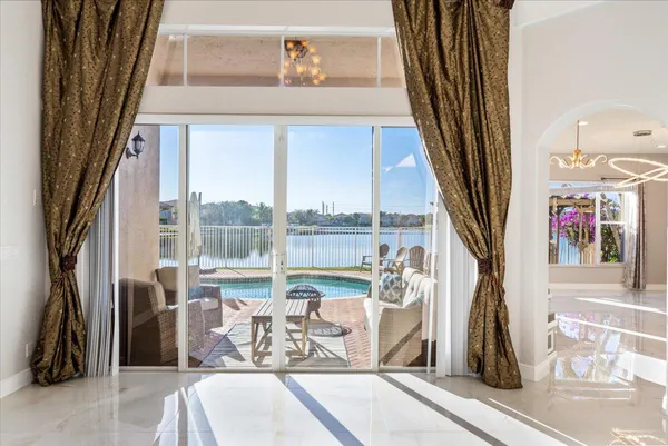 a view of a living room with a floor to ceiling window