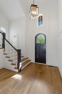 a view of an entryway with wooden floor