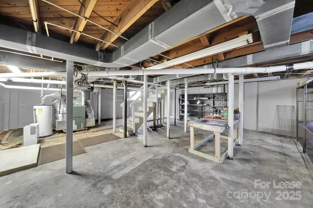 a view of a room with wooden chairs