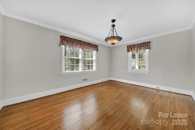 a view of an empty room with windows