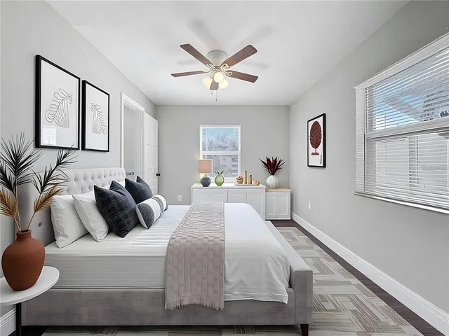 a bedroom with a bed and window