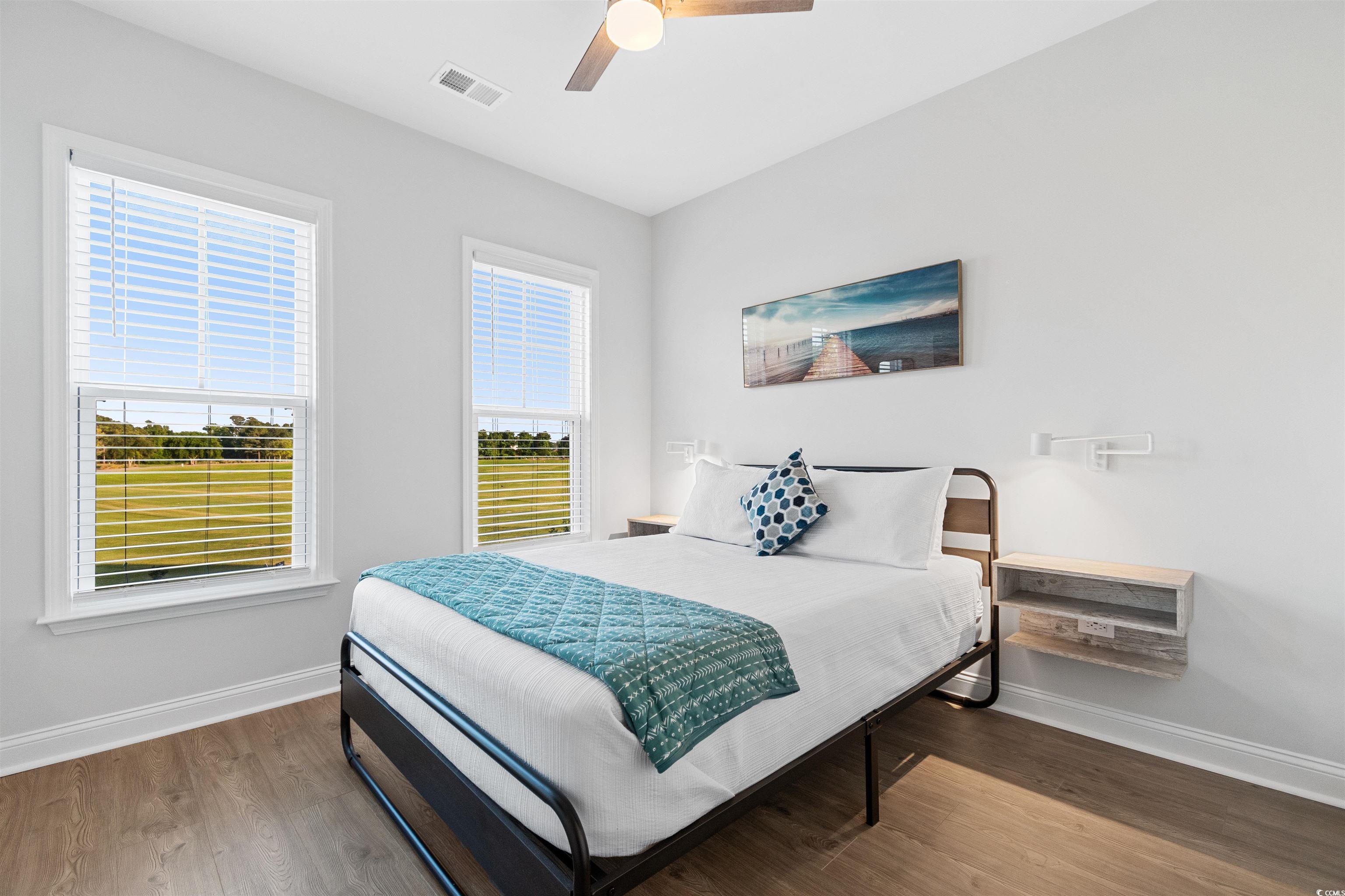 5117 Double Eagle Way North Myrtle Beach, SC 29582 - Photo 13 of 20 Bedroom featuring wood finished floors and a ceiling fan