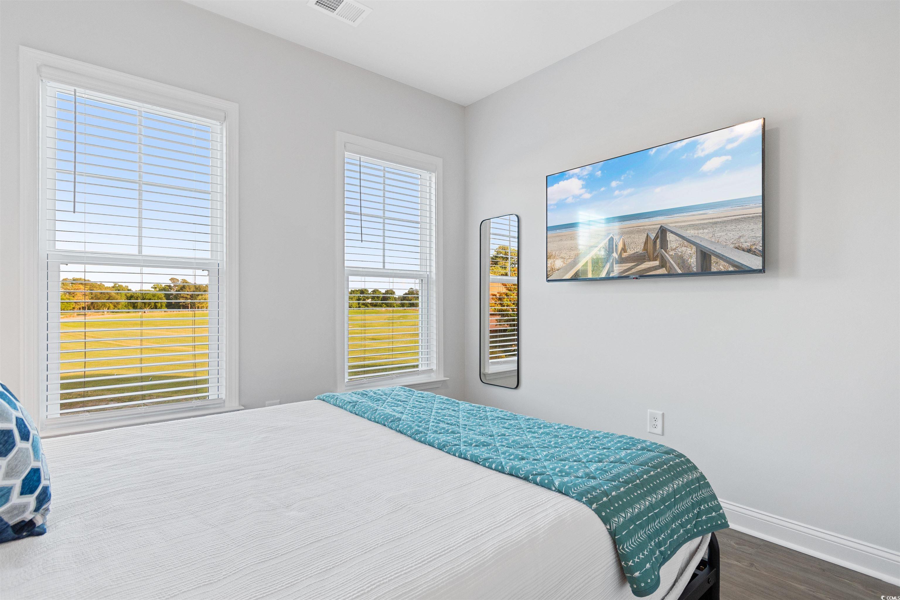 5117 Double Eagle Way North Myrtle Beach, SC 29582 - Photo 14 of 20 Bedroom featuring wood finished floors and baseboards