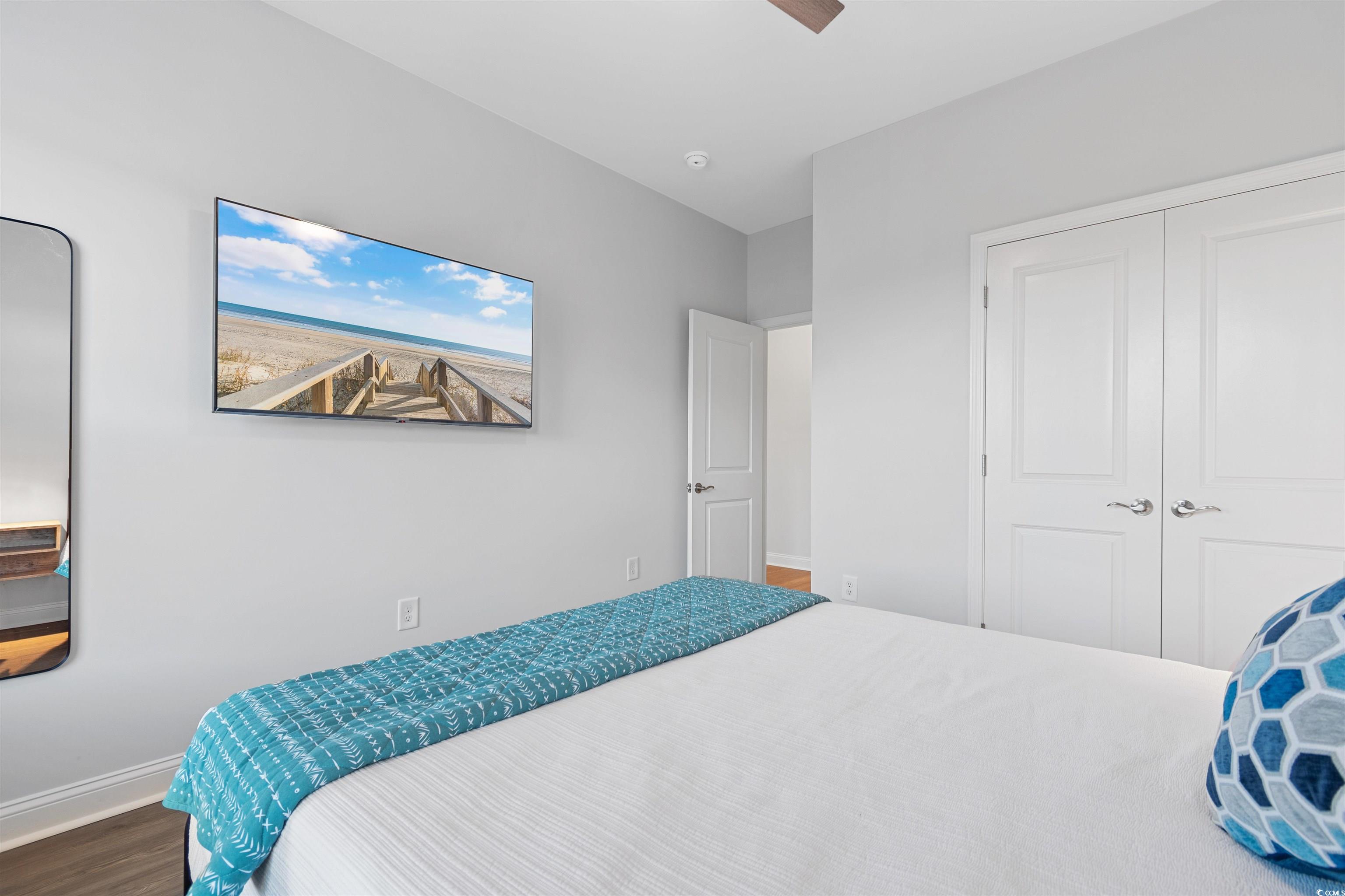 5117 Double Eagle Way North Myrtle Beach, SC 29582 - Photo 15 of 20 Bedroom with wood finished floors, ceiling fan, and a closet