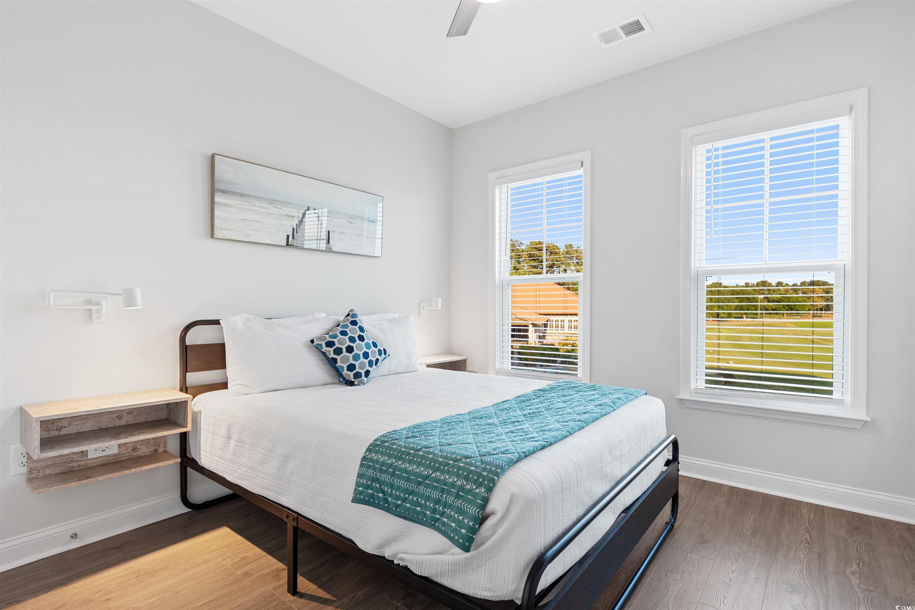 5117 Double Eagle Way North Myrtle Beach, SC 29582 - Photo 17 of 20 Bedroom featuring wood finished floors and ceiling fan
