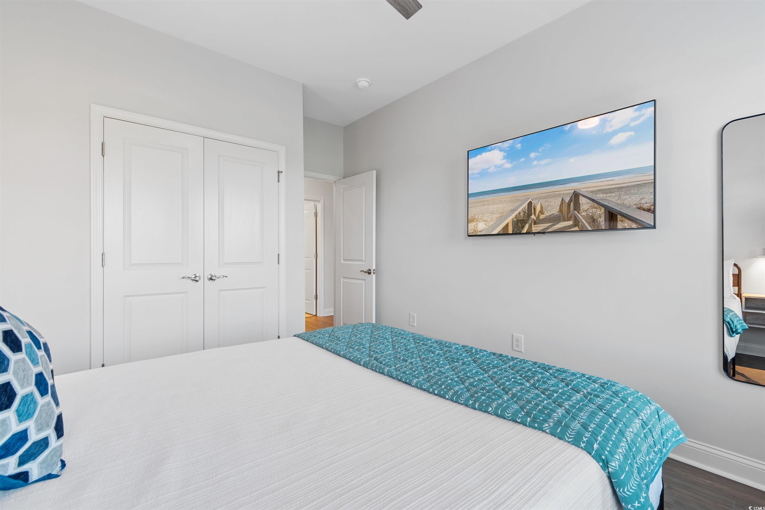 5117 Double Eagle Way North Myrtle Beach, SC 29582 - Photo 19 of 20 Bedroom featuring wood finished floors, a ceiling fan, and a closet