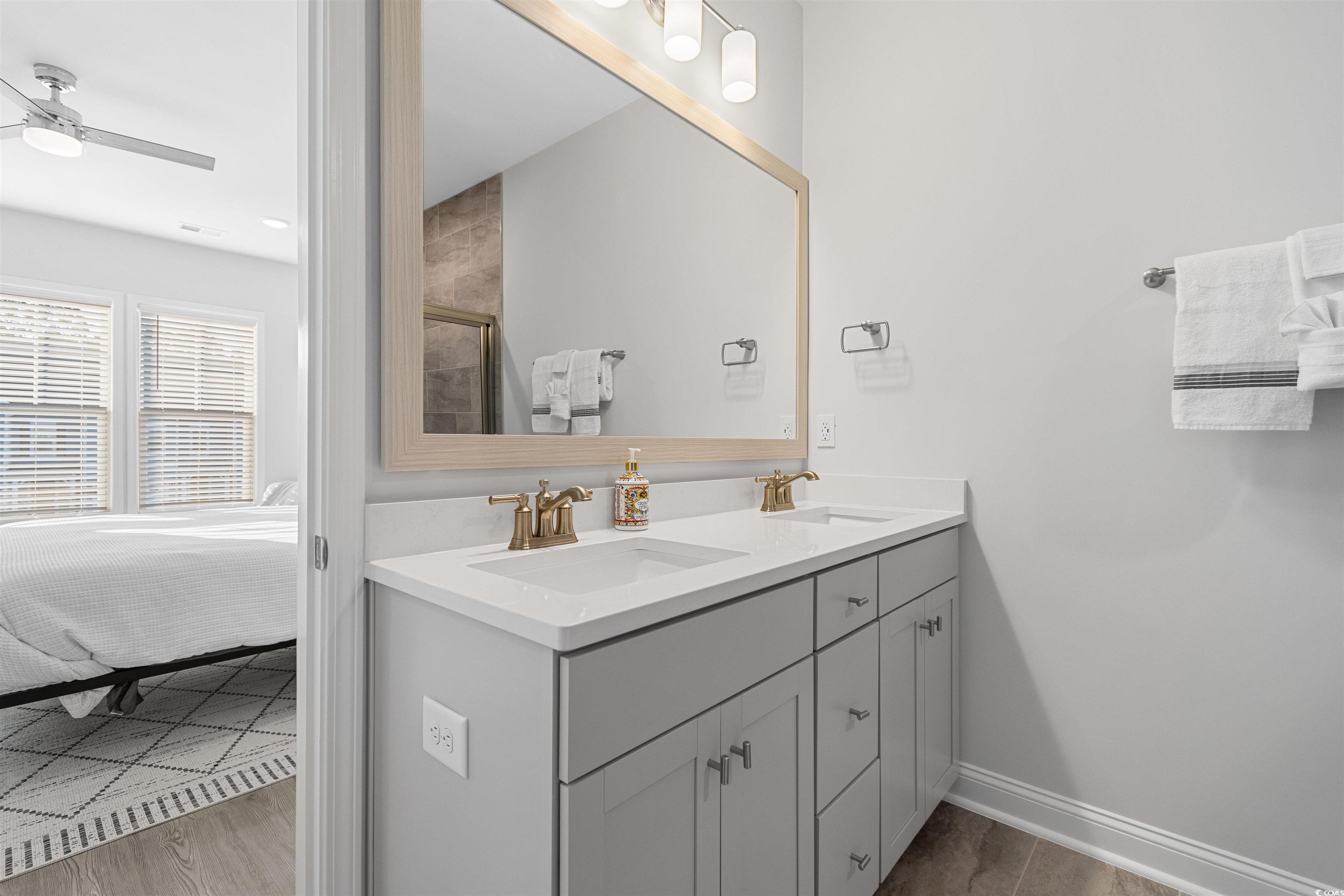 5117 Double Eagle Way North Myrtle Beach, SC 29582 - Photo 20 of 20 Bathroom featuring double vanity and a ceiling fan