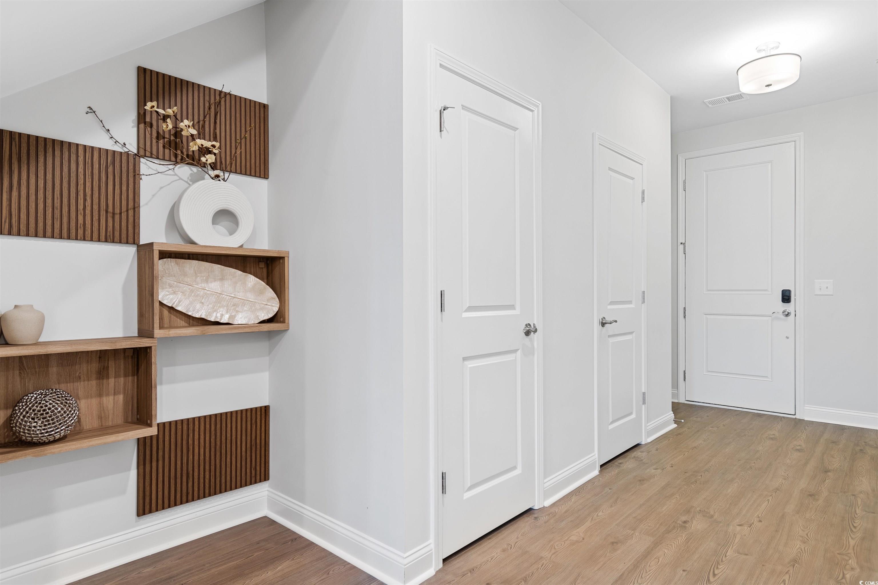 5117 Double Eagle Way North Myrtle Beach, SC 29582 - Photo 8 of 20 Hall featuring light wood-type flooring and baseboards