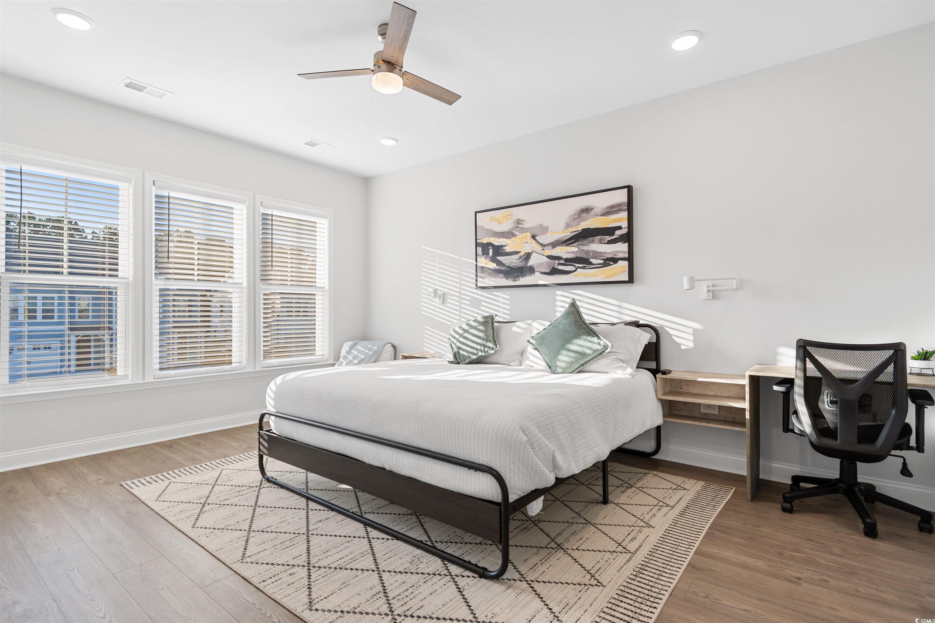 5117 Double Eagle Way North Myrtle Beach, SC 29582 - Photo 9 of 20 Bedroom featuring light wood-style floors, ceiling fan, recessed lighting, and a desk