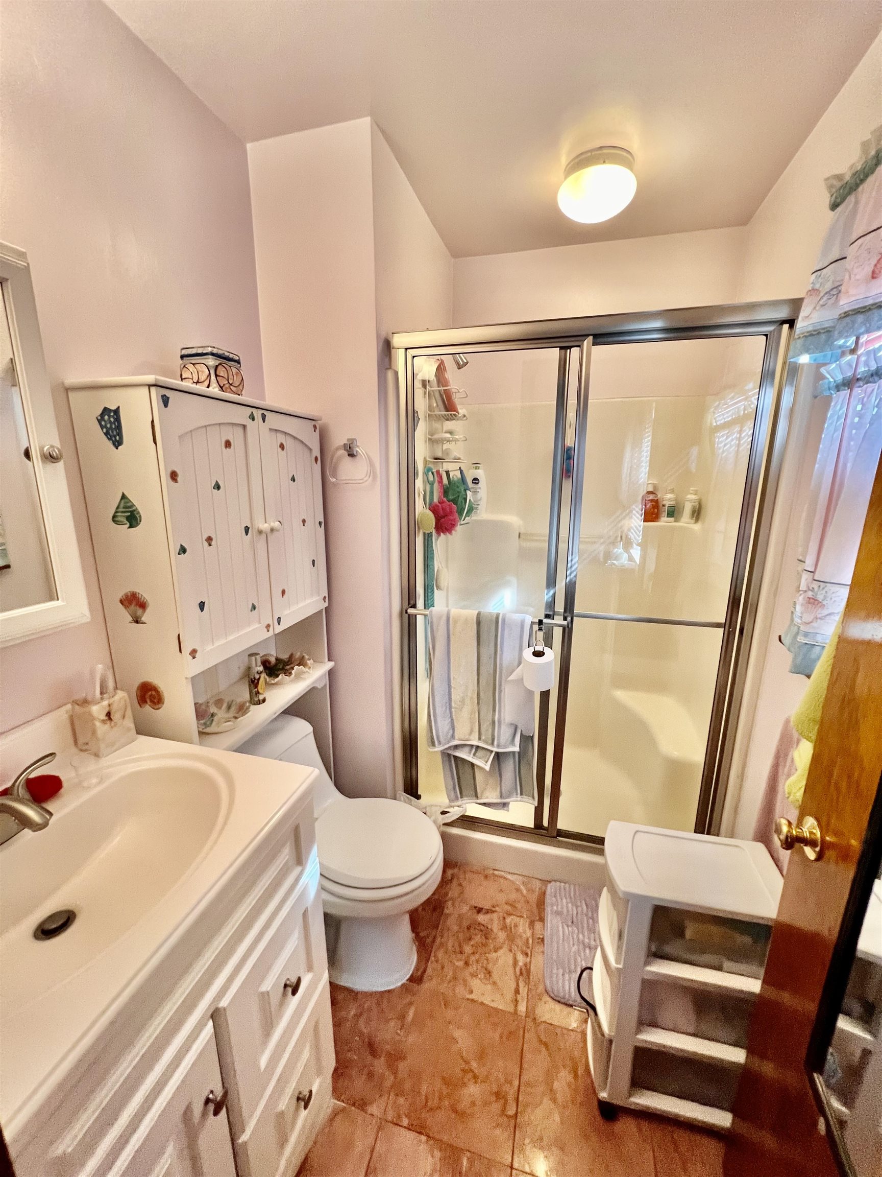 532 West Anglesea Drive, Unit A North Wildwood, NJ 08260 - Photo 11 of 28 a bathroom with a sink toilet and shower