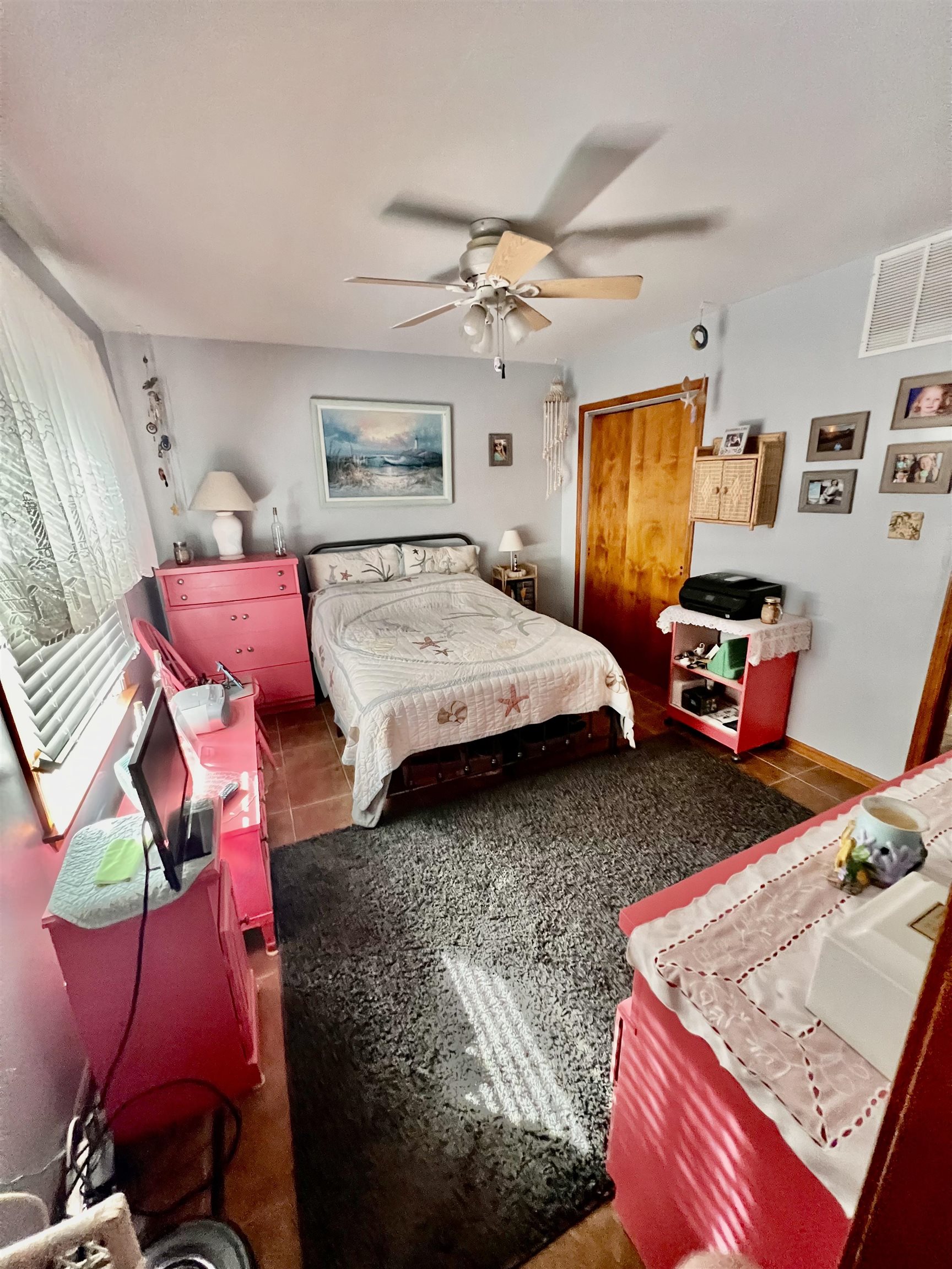 532 West Anglesea Drive, Unit A North Wildwood, NJ 08260 - Photo 14 of 28 a bedroom with a bed and window