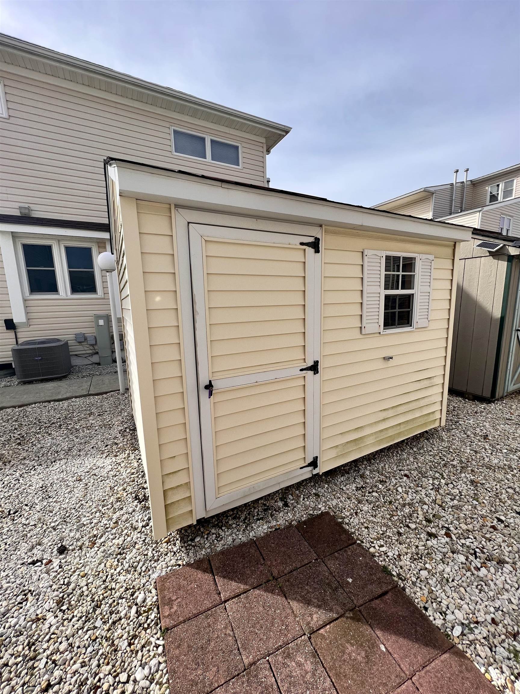 532 West Anglesea Drive, Unit A North Wildwood, NJ 08260 - Photo 26 of 28 a view of a house with a wooden bench