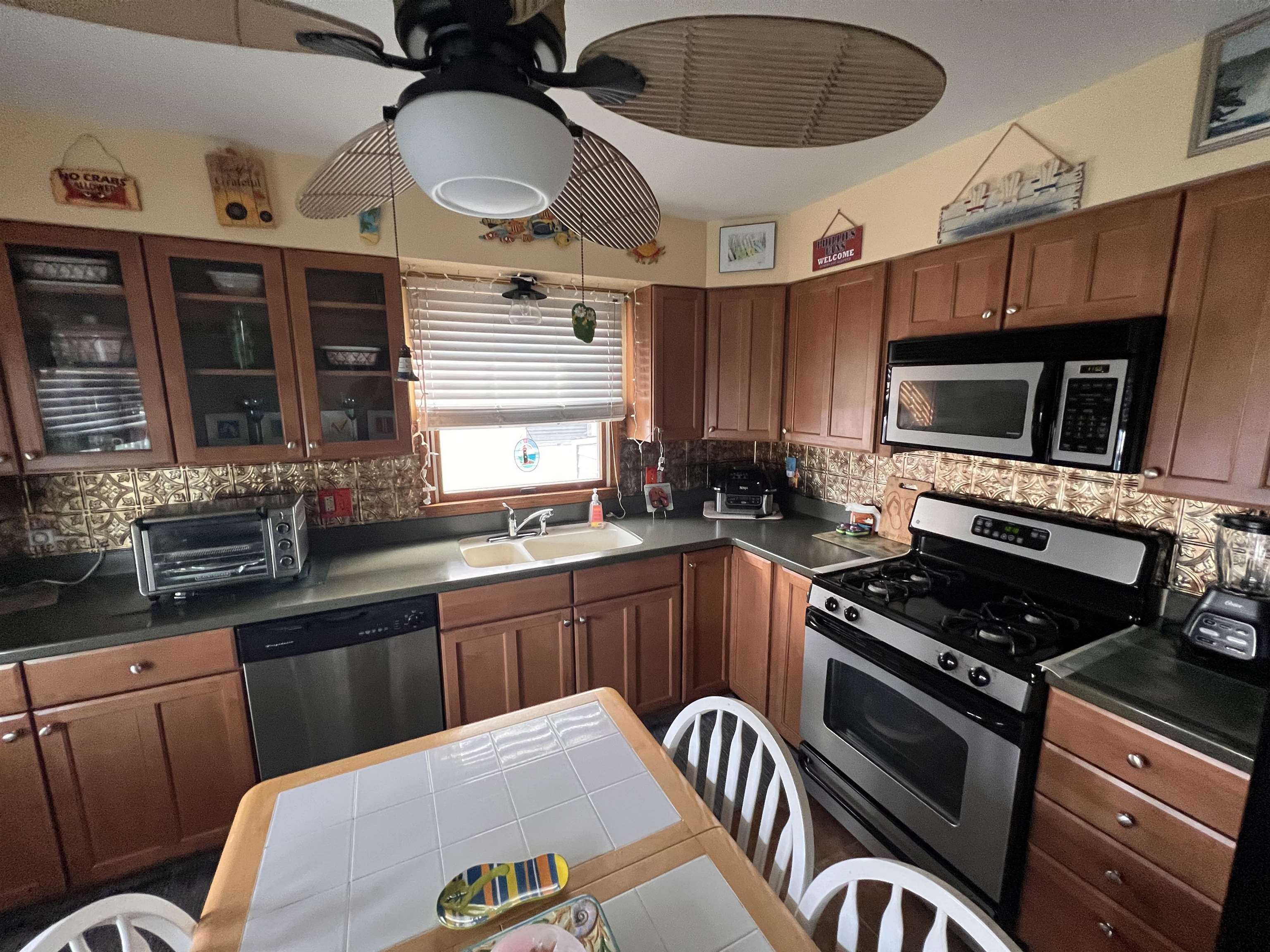 532 West Anglesea Drive, Unit A North Wildwood, NJ 08260 - Photo 8 of 28 a kitchen with stainless steel appliances a stove a sink and a microwave