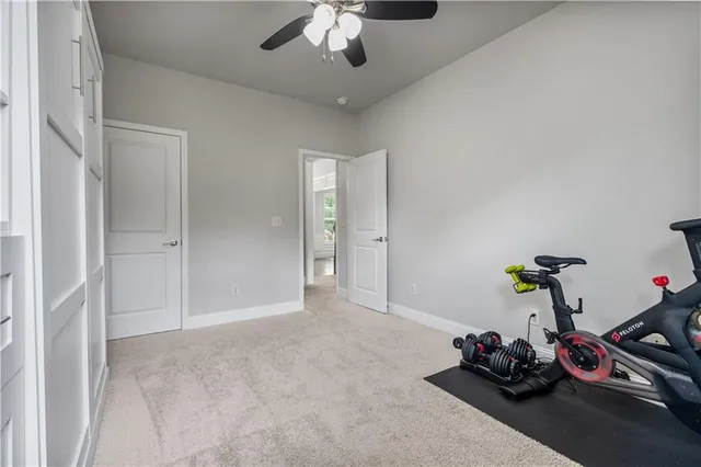 a bedroom with a bed and a television