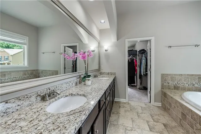 a view of staircase with railing and a rug