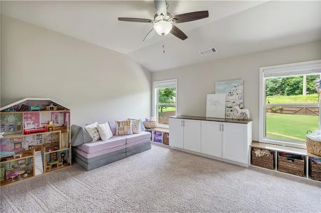a en suite bathroom with a double vanity sink and a mirror