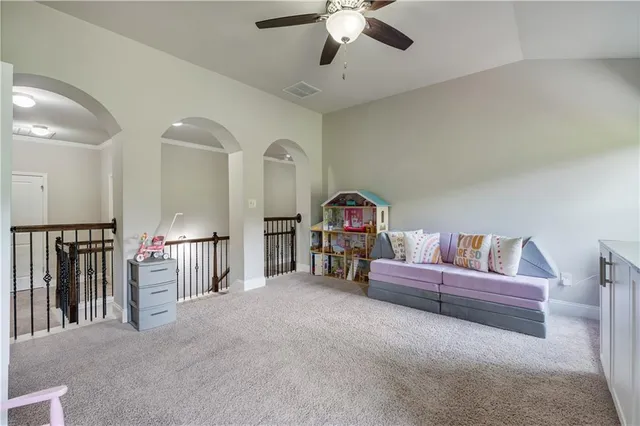 a white toilet sitting next to a shower curtain