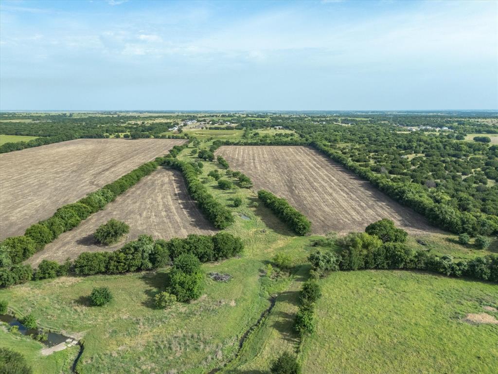 3506 County Road 1106 Rio Vista, TX 76093 - Photo 17 of 40 Aerial view of property and surrounding area with rural landscape and abundant farmland