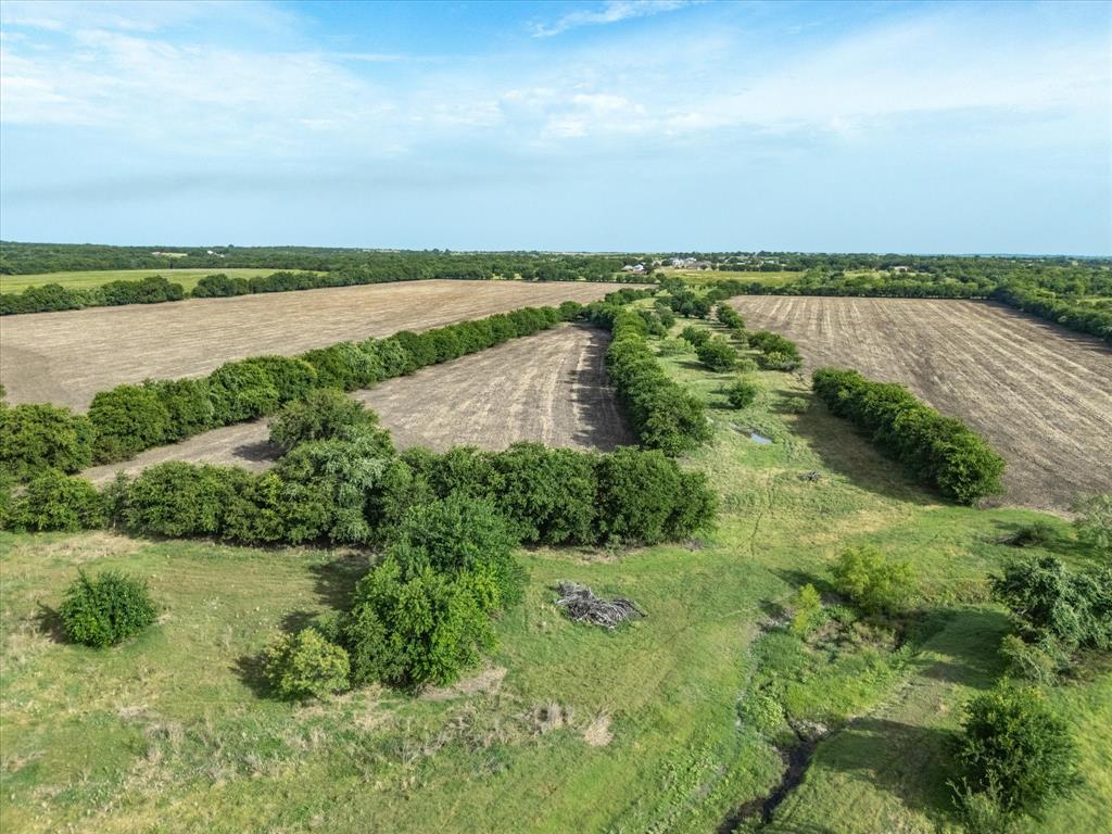 3506 County Road 1106 Rio Vista, TX 76093 - Photo 3 of 40 Aerial overview of property's location featuring rural landscape and rows of crops