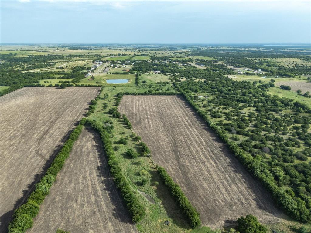 3506 County Road 1106 Rio Vista, TX 76093 - Photo 38 of 40 Aerial view of property and surrounding area with rural landscape