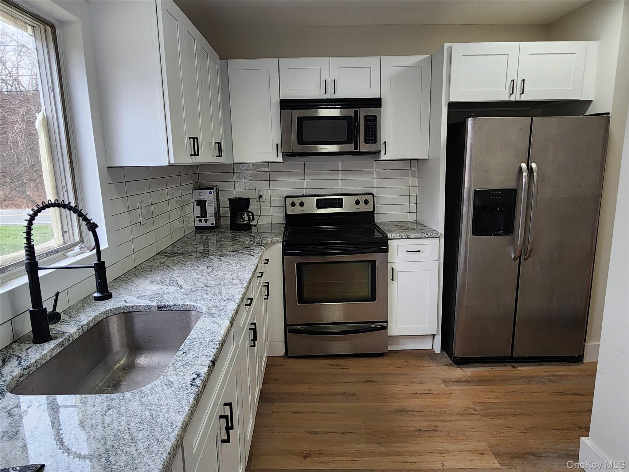 20 Hankins Road Hankins, NY 12741 - Photo 12 of 30 a kitchen with granite countertop a refrigerator and a sink