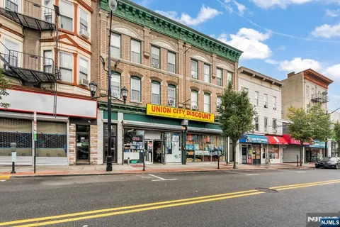 a view of a food mall next to a building