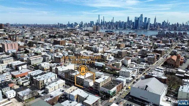 an aerial view of a city with lots of residential buildings