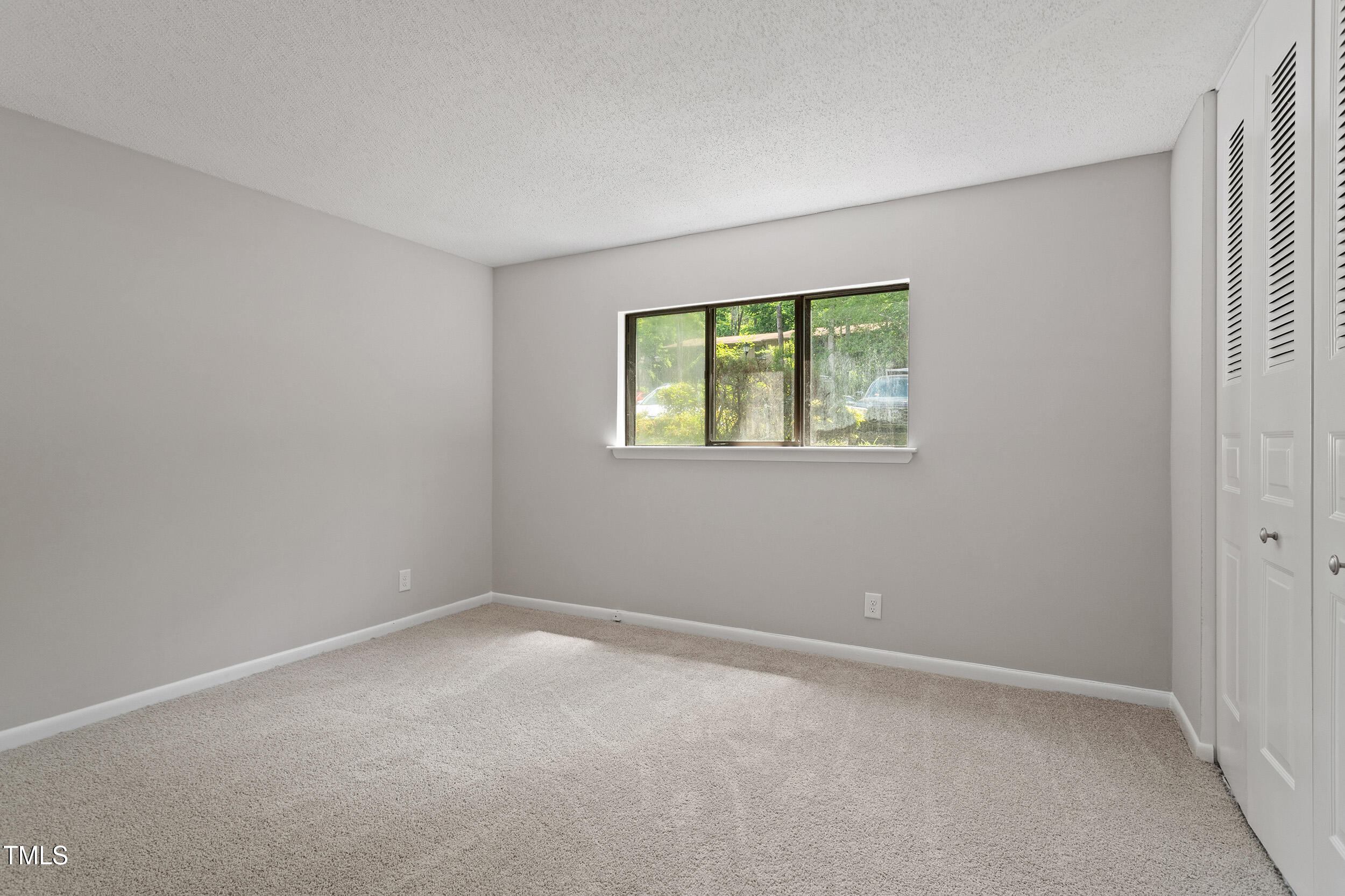 3088 Colony Road, Unit A Durham, NC 27705 - Photo 17 of 24 an empty room with windows